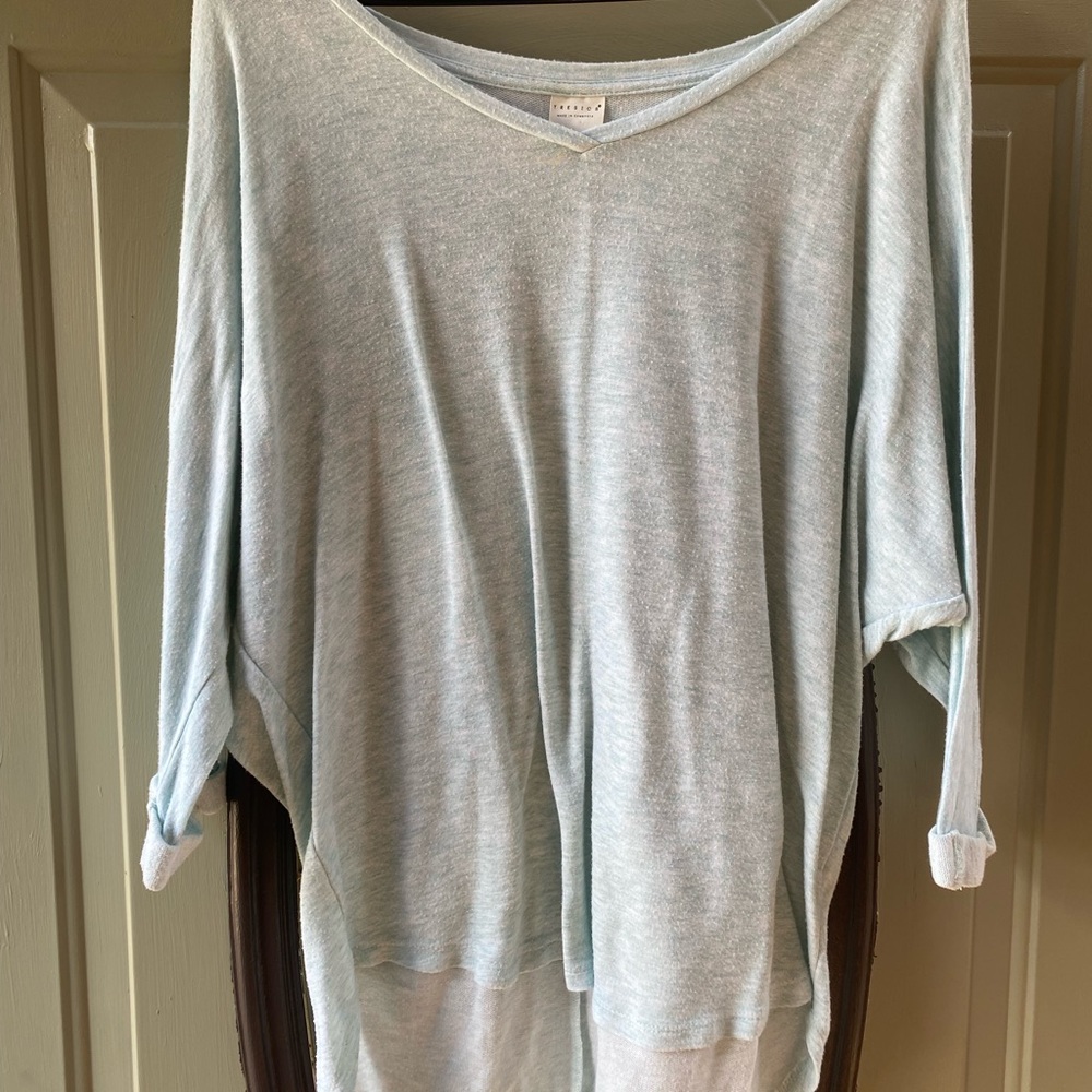 Light blue 3/4 sleeve shirt. Thin material. Size large